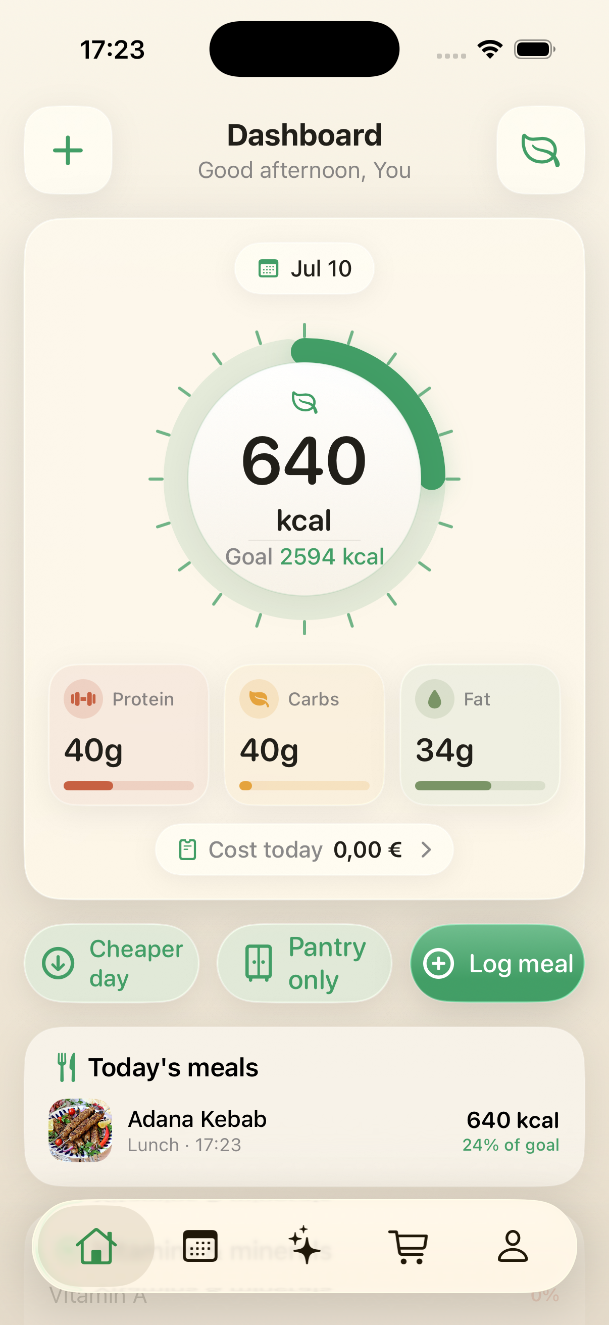 Dashboard with a calorie ring, macro cards and a logged meal